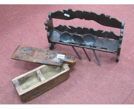 A XIX Century Spoon Rack 24cm wide, holding three pewter spoons. North African wooden spice box, with carved swivel lid.