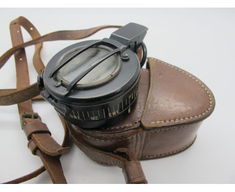 Prismatic Compass, probably Military in black lacquer, rubber circle to base no visible makers stamp, with leather case.&nbsp