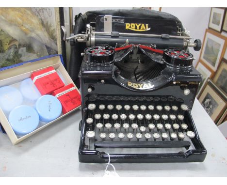 Royal 10 Typewriter, circa early XX Century with glass side panels, together with ribbons.