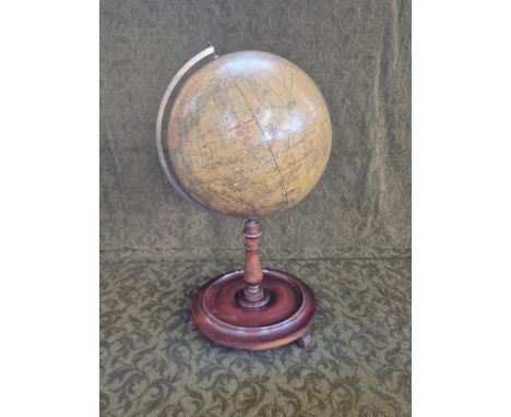 Edwardian Library Globe on turned mahogany stand with brass mounts.