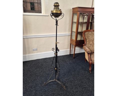 Edwardian wrought iron oil lamp standard with brass mountings and height adjustment, complete with bowl oil lamp (burner dama