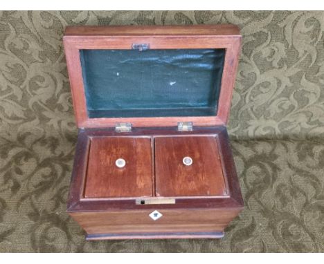 Mahogany sarcophagus tea caddy, twin compartment interior on brass bun feet with bone escutcheon, 20cm wide.