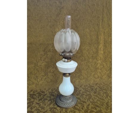 Victorian oil lamp with decorative brass base, white glass vessel and Hinks Patent burner.