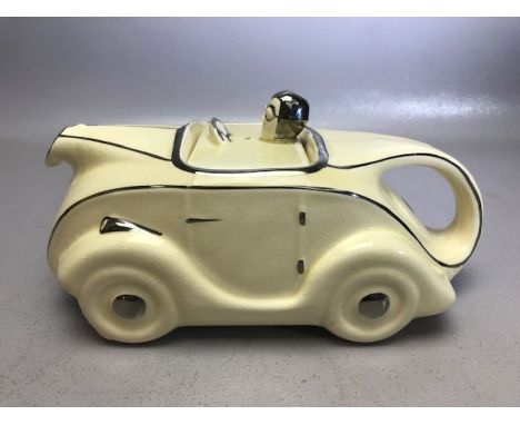 Sadler Art Deco OKT 42 racing car ceramic teapot in white and silver glazes, approx 23cm in length