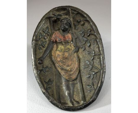 Heavy metal / iron oval dish with the figure of a woman picking apples from a ladder; figure protrudes to the back of the bow
