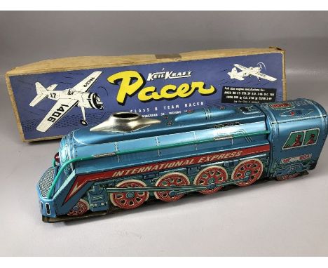 Vintage toys: a Keil Kraft boxed 'Pacer Class B Team Racer' model aeroplane kit, 30 inch wingspan and an 'International Expre