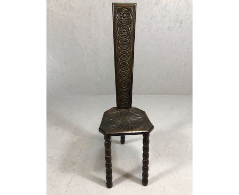 Oak prayer stool, possibly Welsh in origin, on three bobbin turned legs, with carved detailing to back and seat