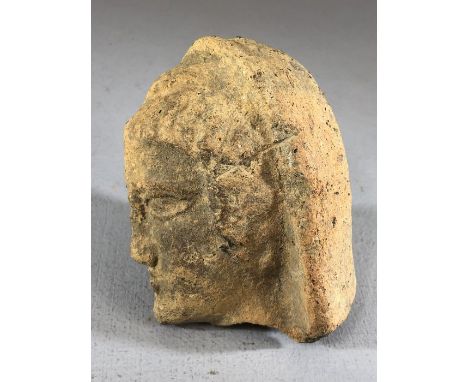 Moulded ceramic / pottery votive depicting a bisected male head, general surface wear and chips are present, approx 10cm in l
