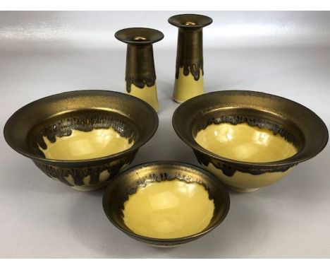 Lustre slipware ceramic set in mustard and copper drip glaze to include two bowls, approx 15.5cm in diameter, a smaller bowl 
