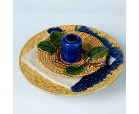 In a yellow basket woven pattern with a cobalt blue accent. Includes a Boch Luxembourg candlestick holder with a leaf motif, 