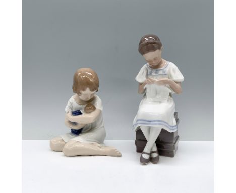 A young woman seated on a wooden crate attentively cares for fabric, while another figurine depicts a woman on her knees tend