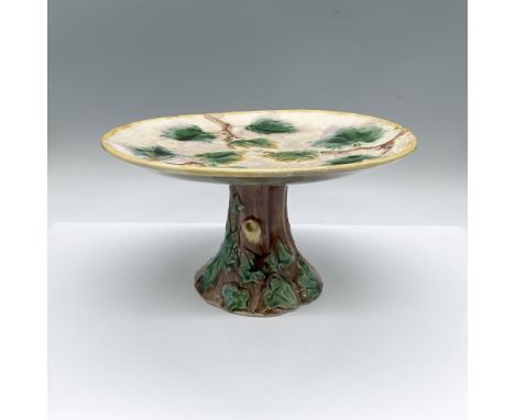 Hand made and hand painted American pottery. Depicts a round 9.25-inch tray, adorned with green maple leaves, atop of the ped