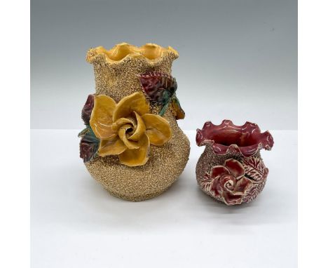 2 small vases with rough sandpaper-like surface and glossy raised flowers. A mustard-yellow and a light maroon-red. Yellow: 5