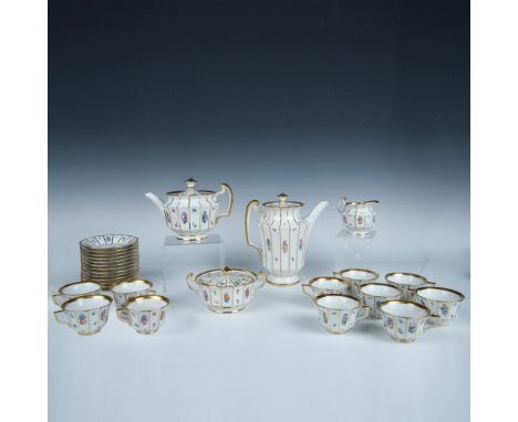 White porcelain adorned with colorful painted flowers and gilt outlined panels. Set includes 1 covered coffee pot (8.5"L x 5"