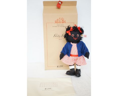 Steiff golly girl teddy bear with box & coa Notice from the the-saleroom.com: These items are listed on the basis they are il