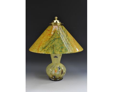 A Vasart style table lamp in swirling shades of yellow, orange and green, the ovoid base with tapering cylindrical neck, coni