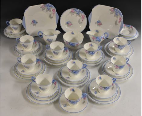 A  Shelley Oxford shape tea service, for twelve, comprising cups, saucers, side plates, milk jug, sugar bowl and two bread an