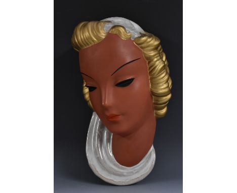 A Goldscheider West Germany terracotta wall mask, modelled as a lady of fashion with curling golden locks and a white scarf i