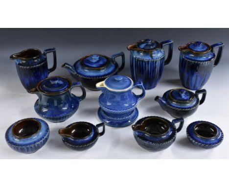 A Bourne Denby Danesby Ware Aladdin teapot, stand, hot water jug, milk jug and sugar bowl, Electric Blue drip glaze, printed 