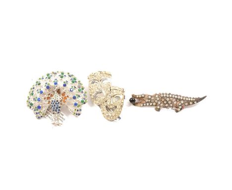 Twenty-one vintage novelty paste brooches, 50mm ox wagon with articulated wheels; five fish brooches; rhodium-plated 60mm fly