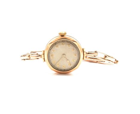 A lady's vintage yellow metal bracelet wristwatch, circular Arabic dial in a 24mm case hallmarked Birmingham 1930, expanding 