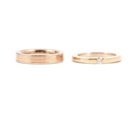 A 4mm wide white metal flat band inset with a yellow metal inner band ring size K, marked 750, 8.9g; a 2.2mm wide flat band w