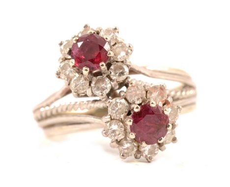 A ruby and diamond double cluster ring, each circular cluster claw set with a ruby and eight brilliant cut diamonds in an all