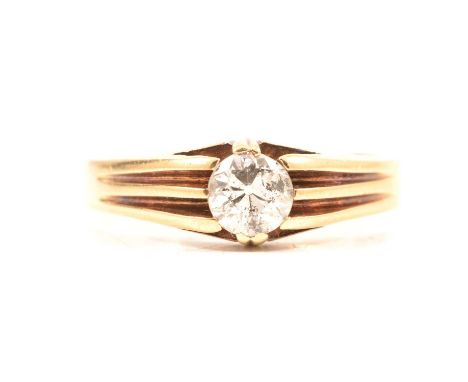 A diamond solitaire ring, the old brilliant cut diamond set in an all yellow metal mount ring size R, 3mm wide half D shape s