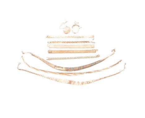 A tray of vintage silver necklaces, bracelets and two lockets, five flexible bracelets 1970's style; two oval lockets, 40mm; 