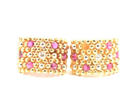 A contemporary ruby and diamond ring and similar single earring, the 15mm wide beaded design ring set with five rubies (one m