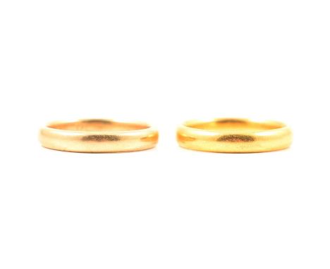 Two wedding rings, an 18 carat yellow gold 3.7mm wide plain polished D shape band ring size R1/2, Birmingham 1929, 5.7g; a 22