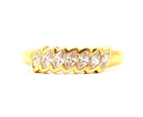 A diamond half hoop ring, seven marquise cut diamonds collet set on the diagonal in an 18 carat all yellow gold mount ring si