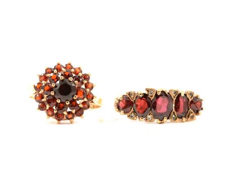 Two 9 carat yellow gold garnet dress rings, a twenty-five stone 10.5mm circular cluster, ring size L1/2, Birmingham 1973; a r