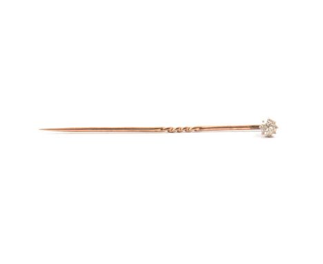 A diamond set stick pin, the 3.7mm diameter old brilliant, cut stone claw set, in a vintage box.