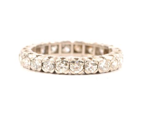 A diamond full eternity ring, twenty-two brilliant cut stones claw set in a 3.2mm wide mount ring size L, gross weight 3.8g.