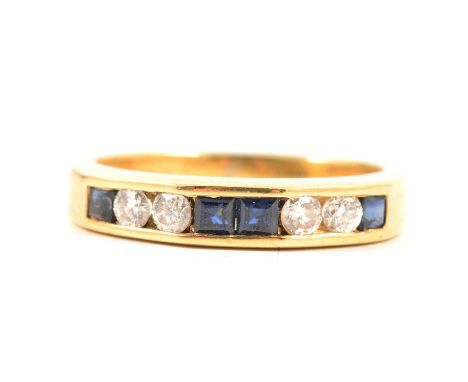 Two eternity ring, an 18 carat yellow gold half eternity ring channel set four brilliant cut diamonds and four square cut sap