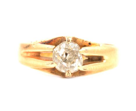 A diamond solitaire ring, the old brilliant cut diamond set in an 18 carat yellow gold mount ring size K, 3.6mm wide half D s