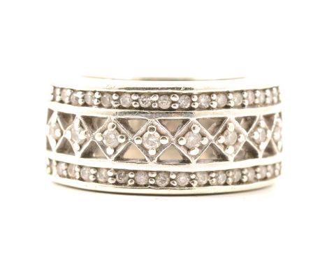 A wide diamond set ring, two outer bands each set with sixteen diamonds flanking an inner band individually set with eight di