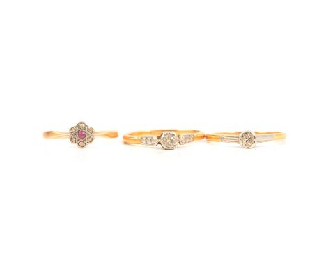 Two diamond solitaire rings and a small cluster ring, the old cut diamonds illusion set in yellow and white metal mounts mark