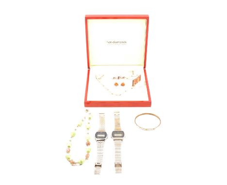 A Hot Diamonds suite of jewellery, comprising necklace (42cm), bracelet (18cm) and earrings with post and butterfly fittings,