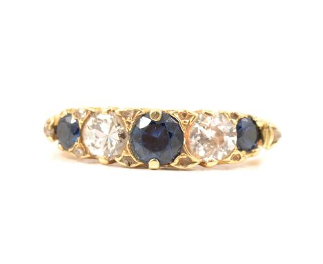 A sapphire and diamond five stone half hoop ring, the two old brilliant cut diamonds and three sapphires, graduating in size 