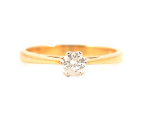 A diamond solitaire ring, the brilliant cut stone claw set in an 18 carat all yellow gold single stone mount ring size L, gro