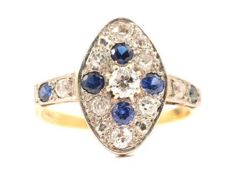 A sapphire and diamond marquise cluster ring, four sapphires and eleven old cut diamonds pip claw and pave set in a yellow an