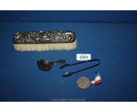 A silver tongs and caddy spoon (a/f.), Teddy tail Jubilee medal and a white metal backed clothes brush.