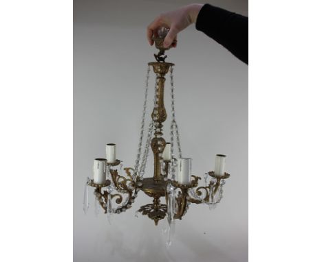 A gilt metal five-branch chandelier light fitting strung with glass droplets, approximately 46cm, (a/f)