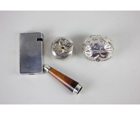 A George VI silver Dunhill lighter (a/f), a Victorian silver mounted cigarette holder, and two novelty white metal boxes mode