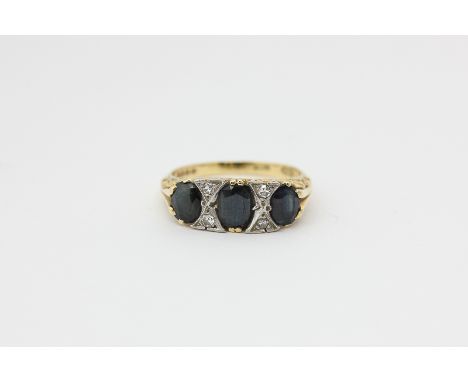 A sapphire and eight cut diamond ring in 18ct gold