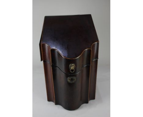 An early 19th century rosewood knife box with lion mask ring handle, star inlaid lid and fitted interior (a/f), 38cm high