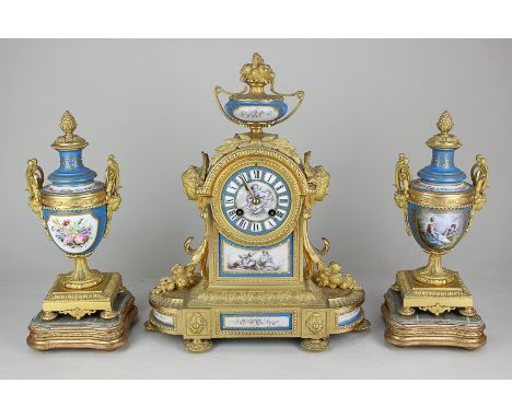 A French gilt metal and porcelain mantel clock, the movement striking on a bell stamped Gay Vicarino &amp; Co, decorated with