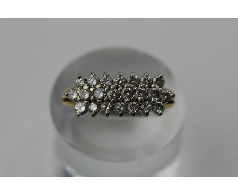 A diamond three row ring in 18ct gold